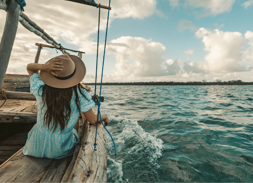 Woman on a boat, symbolising capacity and freedom