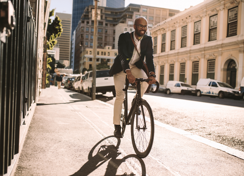 Man cycling, symbolising progress and energy